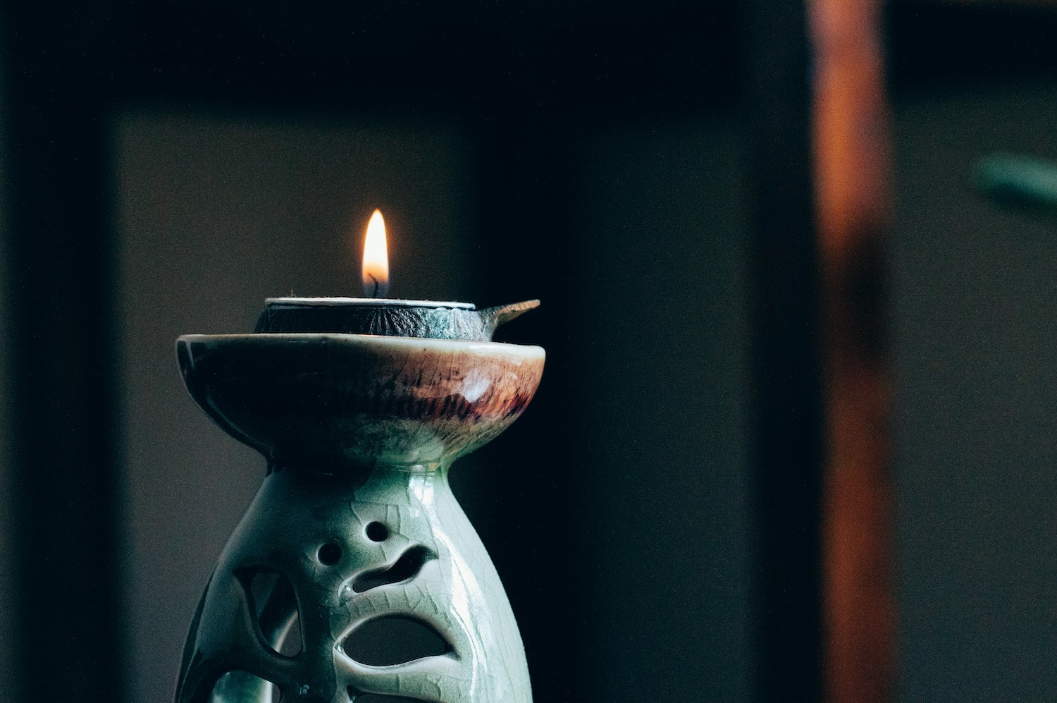 Burning candle in spiritual atmosphere for SoulCollage® cards and creative therapy